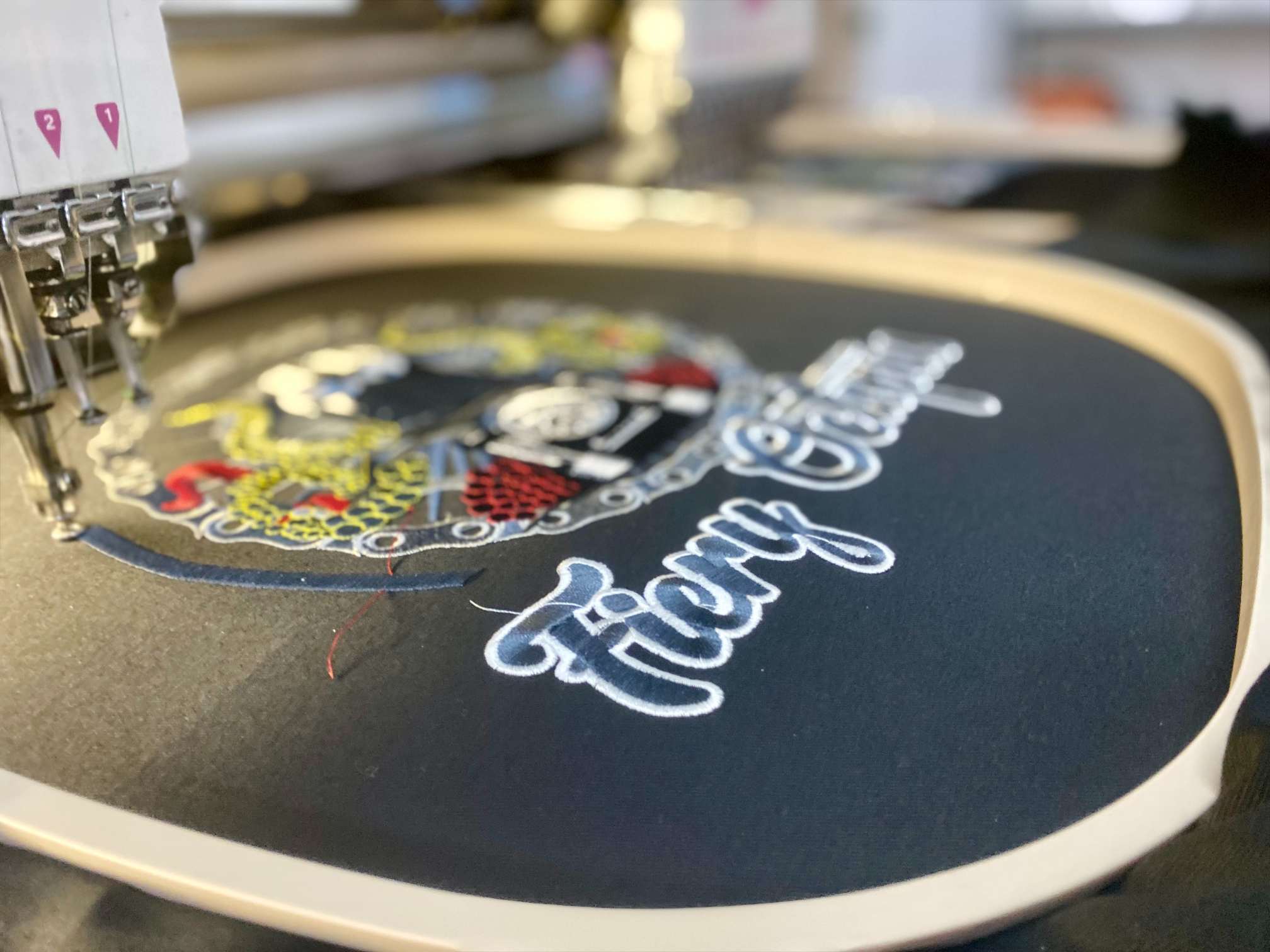 Fiery Octopus embroidery in progress on machine