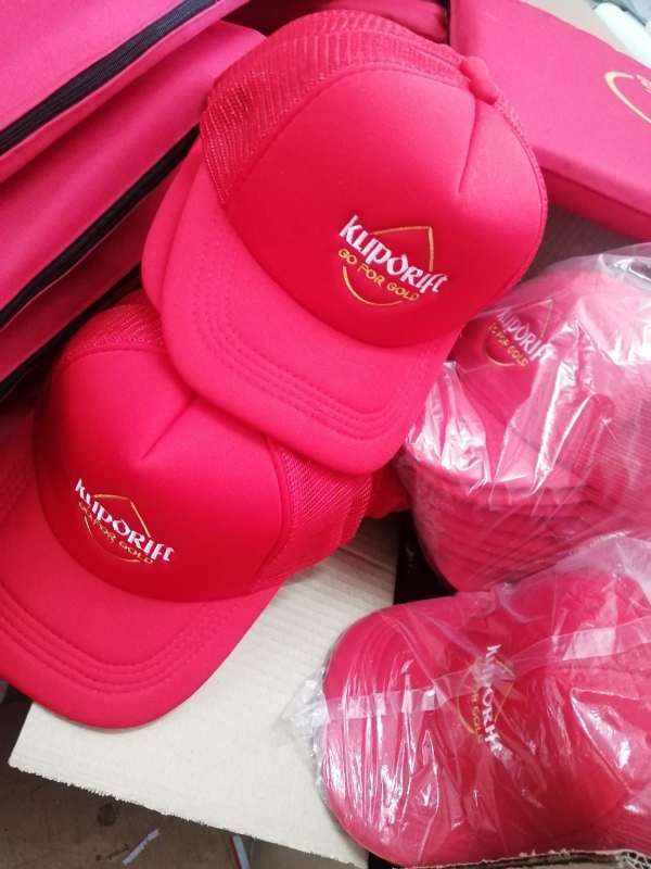 Branded red Klipdrift caps